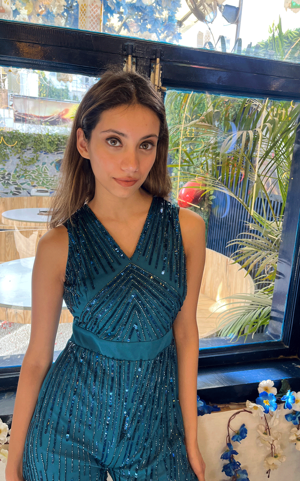 Embellished teal party wear jumpsuit.